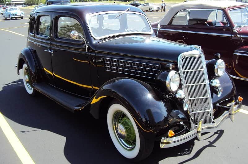 A closeup of a classic black vehicle on display at the Grand Nationals 