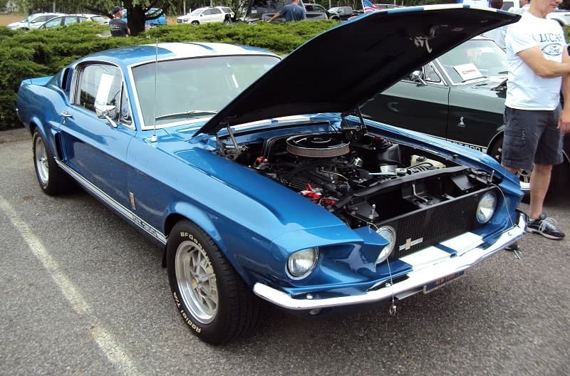 A front side view of a classic Ford Mustang on display 