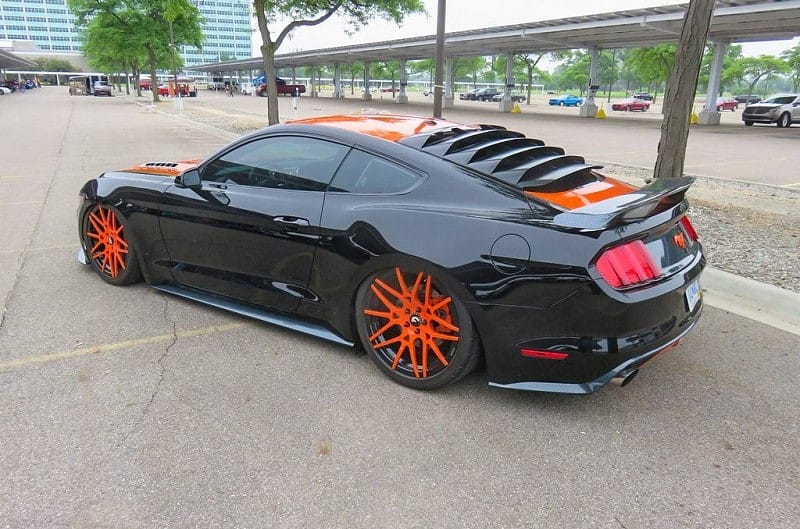 A black and orange Ford Mustang on display at Ford World Headquarters 