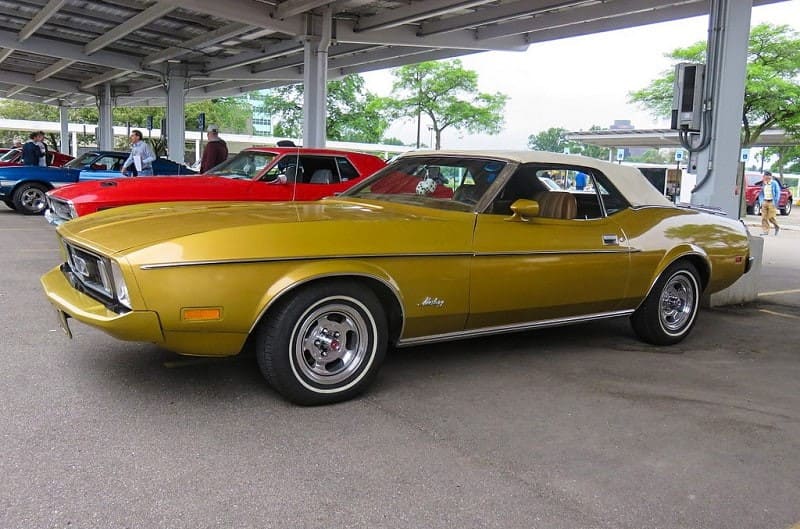 A photo of a gold colored vehicle on display at Ford World Headquarters 