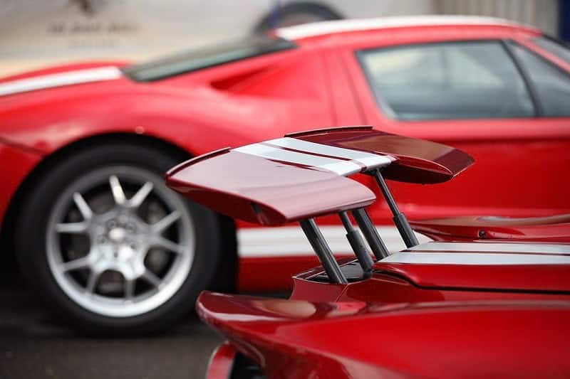A closeup of the spoiler on a red Ford GT 