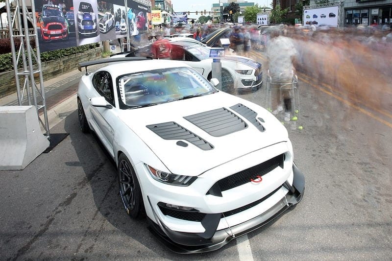 A white Ford Mustang on display 