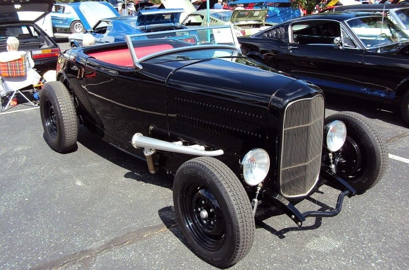 A classic black vehicle on display 