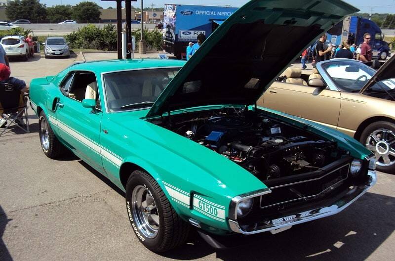 A front side view of a classic Mustang on display 