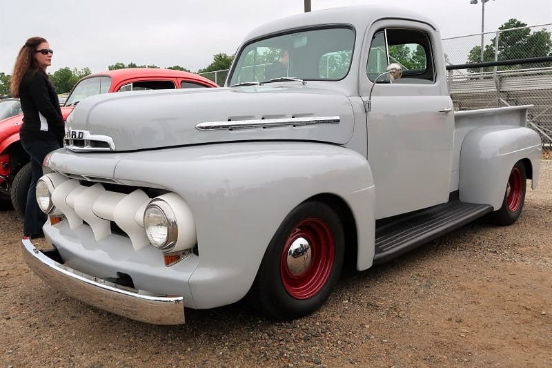 A front side view of a classic truck on display 
