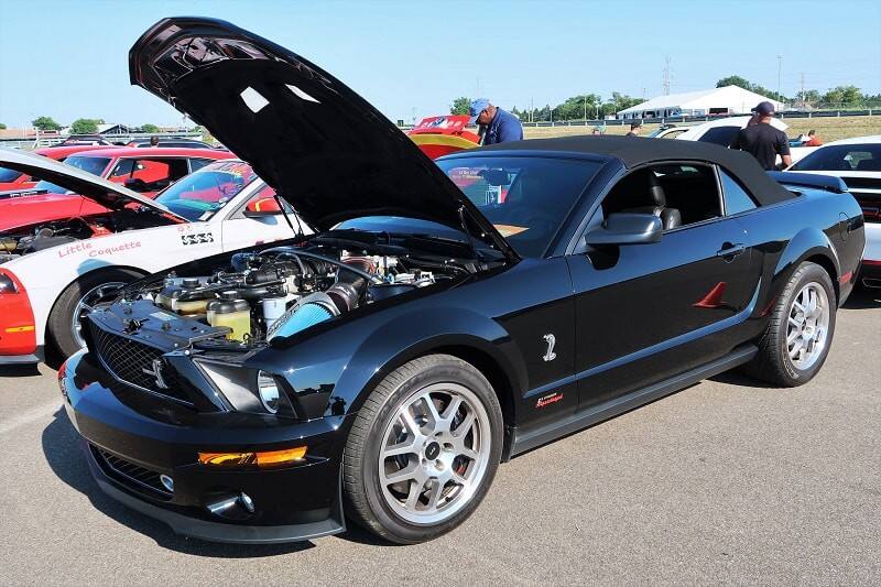 A black Ford Mustang on display 