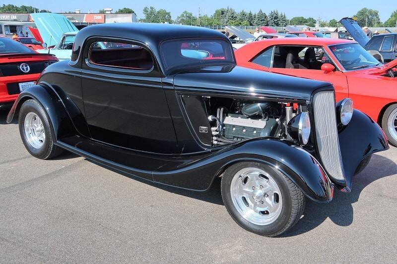 A side view of a classic black hot rod 