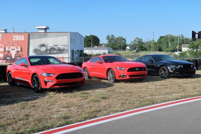 Three Ford Mustangs on display at the M1 Concourse 