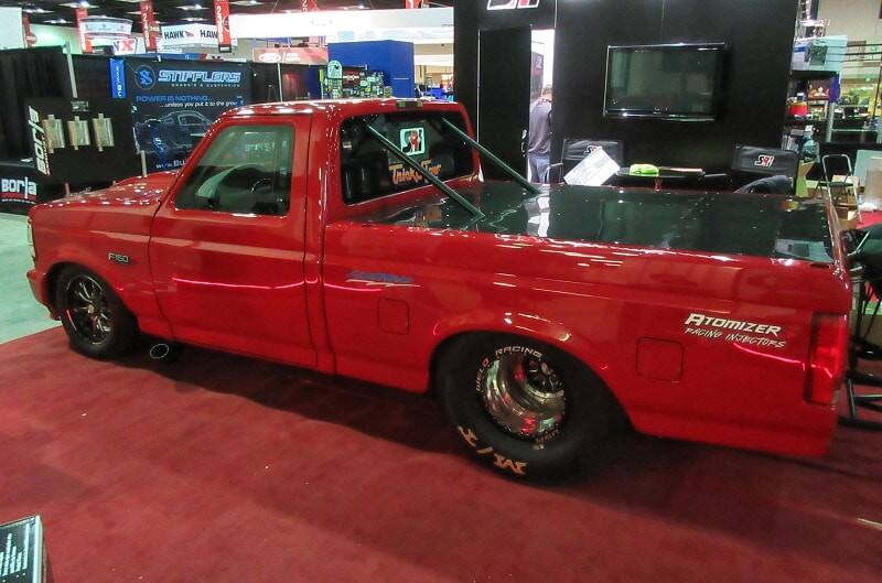 A side view of a red truck on display 