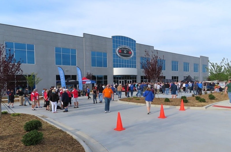 Front of Mustang Owners Museum with crowd in front