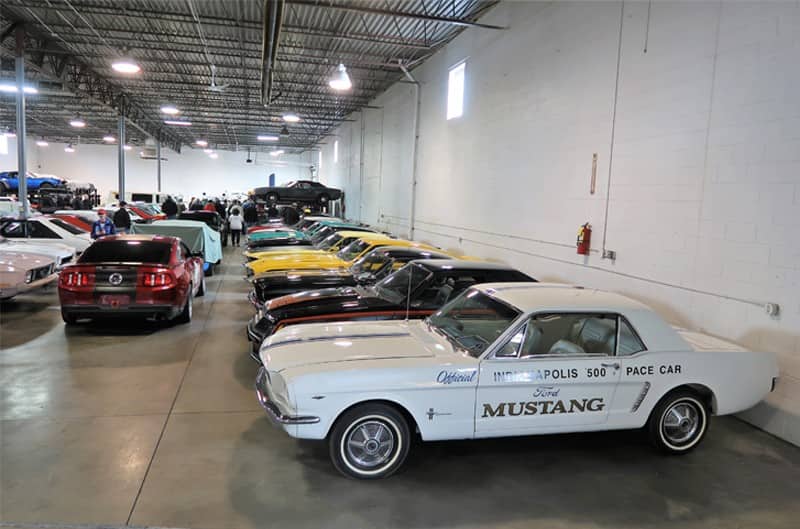 A lineup of classic and current Mustangs on display 