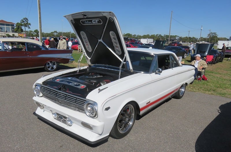 1960s Ford Falcon in white with hood open and Coyote Engine