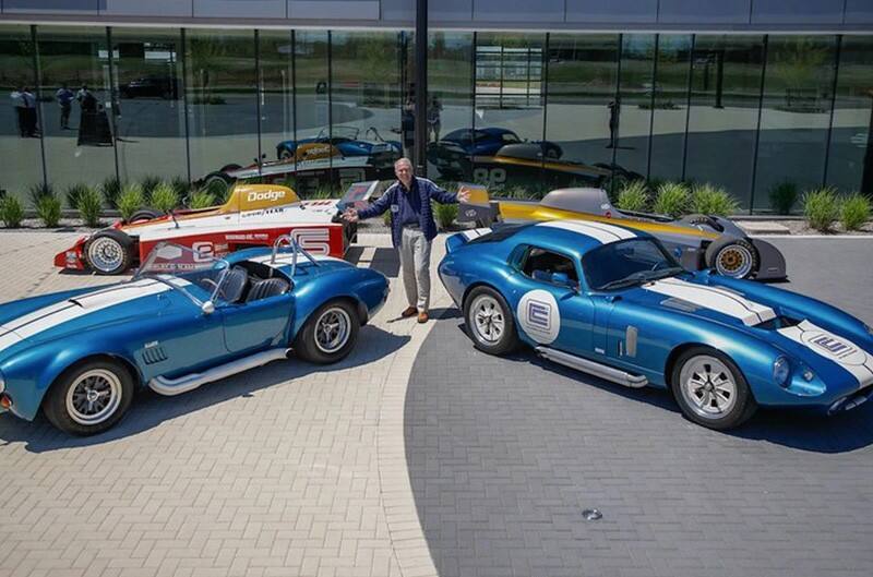 Peter Brock standing with 4 shelbys at M1 Concourse