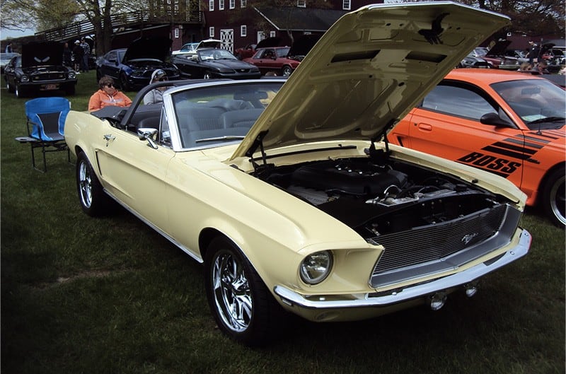 Tan first generation Ford Mustang