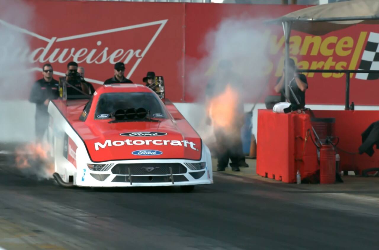 Bob Tasca speeding down the drag strip in his Ford Mustang Funny Car