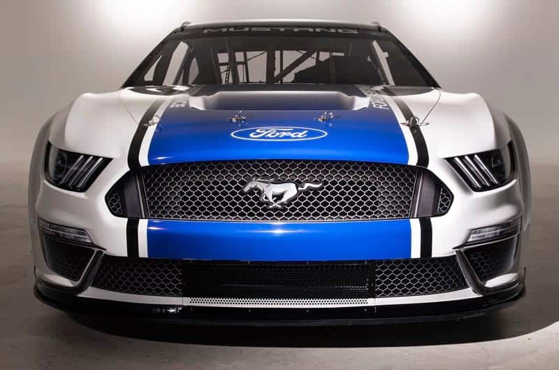 A front view of the 2019 Ford NASCAR Mustang with a blue stripe and white color paint scheme