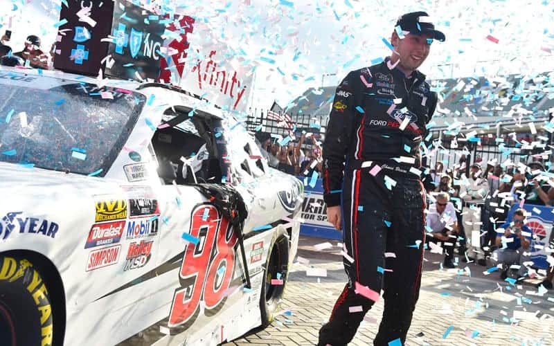 With confetti and fans cheering him on, Chase Briscoe celebrates win at the Charlotte Motor Speedway Roval