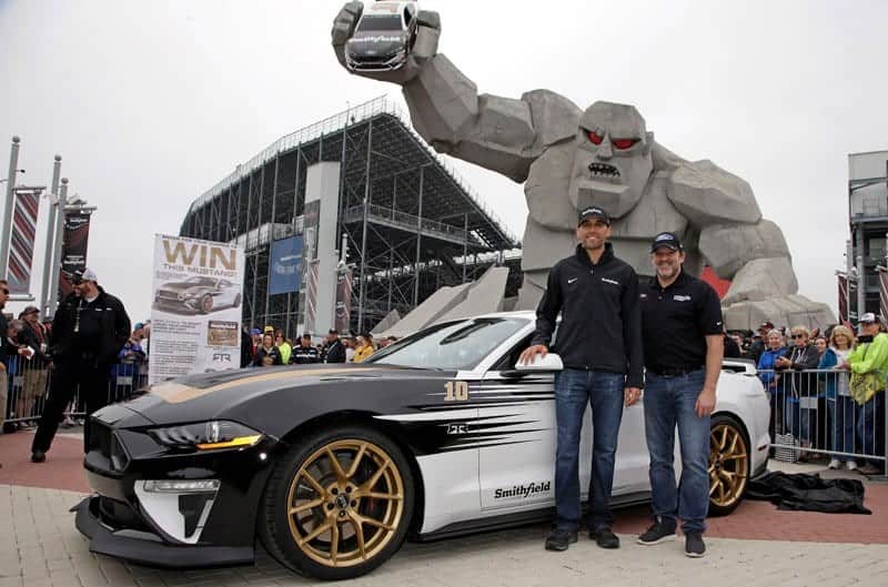 Stewart-Haas Racing driver Aric Almirola and team owner Tony Stewart unveiled the Smithfield Smoke Machine Mustang at Dover