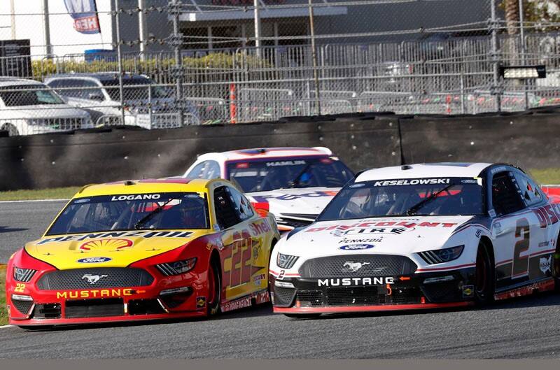 Logano and Harvick Mustangs lead on the track