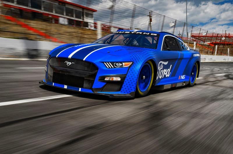 Blue Next Gen Mustang on the track